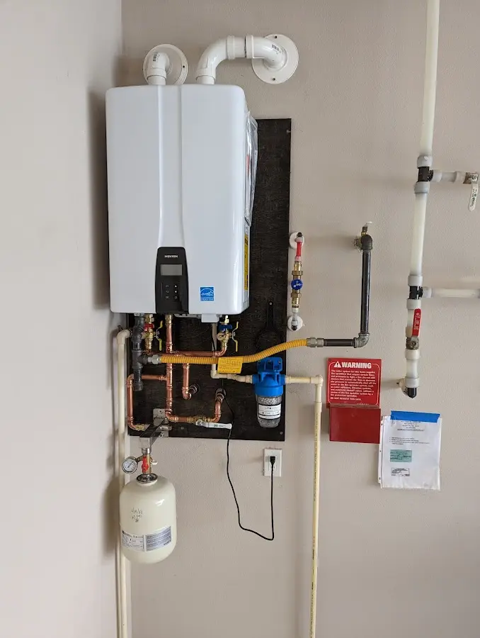 Professional plumber installing copper piping in a East Rancho Dominguez home